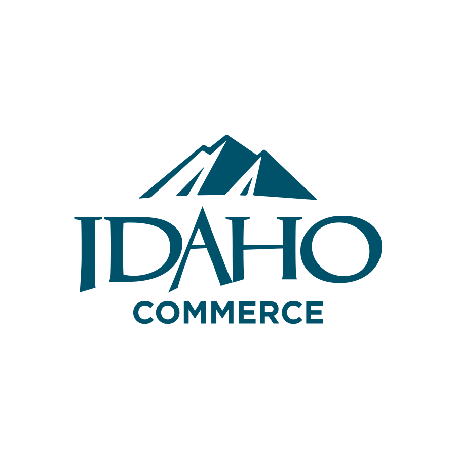 A stylized logo featuring a mountain range and the text 'IDAHO COMMERCE'