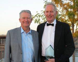 Governor Brad Little stands next to Richard Shaffer who holds his Governor's Lifetime Achievement Award.