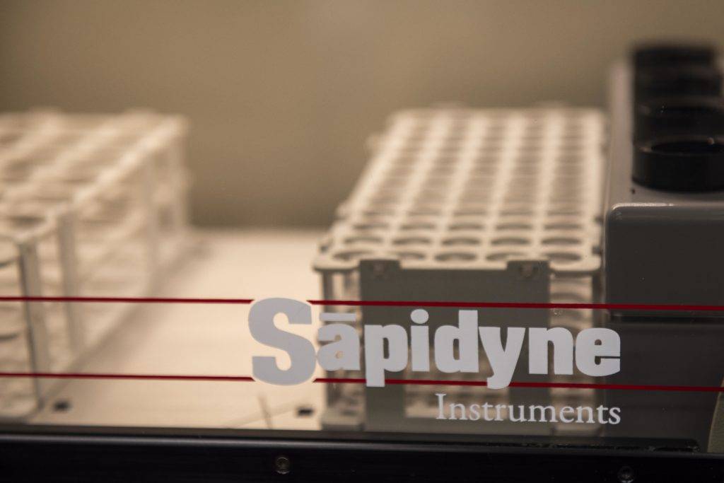 Laboratory equipment with 'Sapidyne Instruments' branding on display