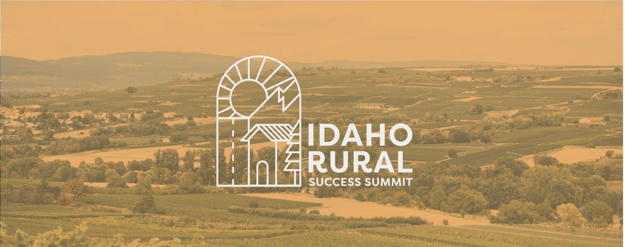 A stylized logo featuring a sun and mountain silhouette over a rural landscape with fields and trees